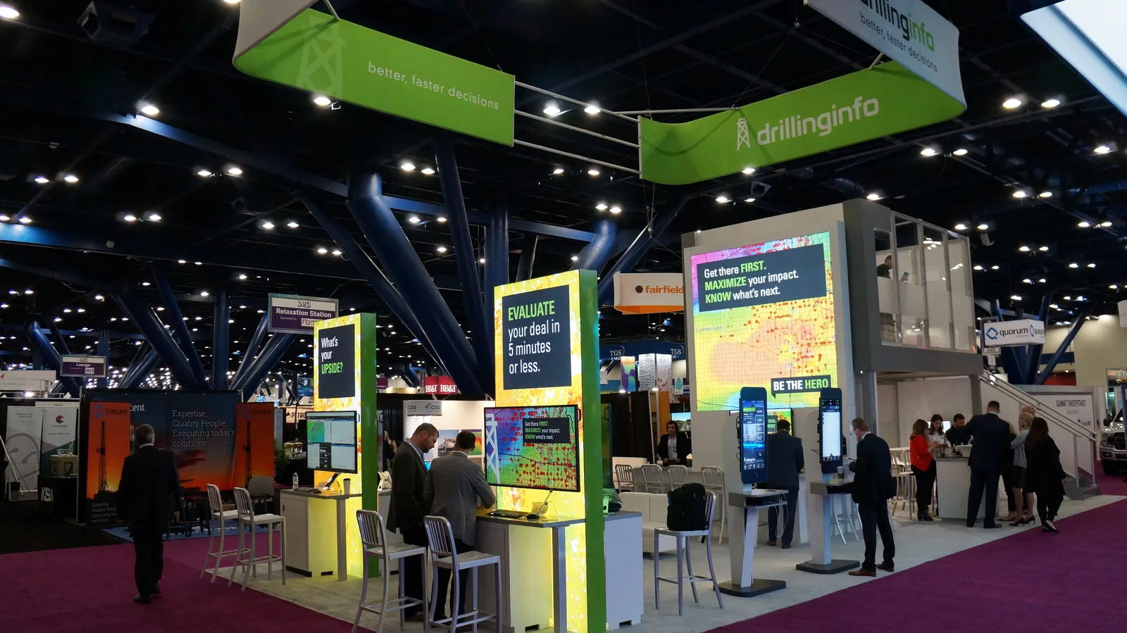 The 90 by 40 ft double-decker booth I designed for NAPE: live data walls, demo stations, and a second deck